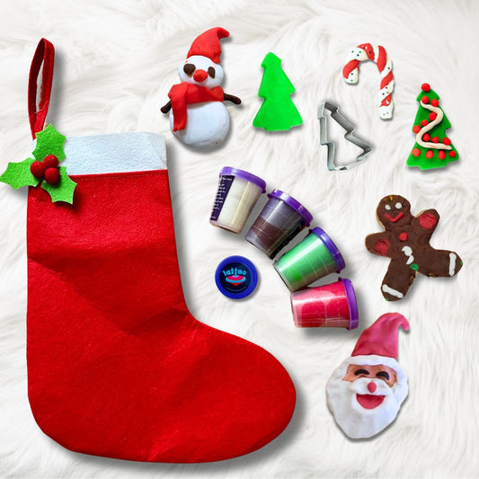 A festive set with 4 vibrant dough colors (red, green, white, brown), a Christmas tree cutter, and a gingerbread man wooden cutout for kids’ creative play.