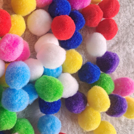 Multi-colored craft pompoms for kids, perfect for creative play, DIY projects, and sensory activities. Non-toxic and eco-friendly materials for safe crafting.