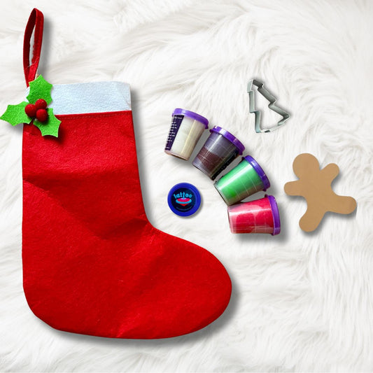 Close-up of kids using holiday play dough tools, showcasing the non-toxic, sensory-friendly dough textures perfect for motor skill development.