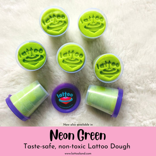 Bright neon green-colored modeling dough shaped into a smooth, rounded mound, with a soft and pliable texture, perfect for creative play and sculpting.