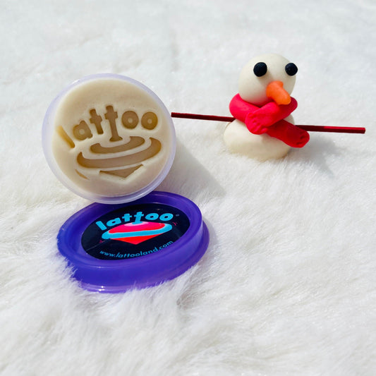 A snowman crafted from white-colored Lattoodough, featuring smooth, soft layers stacked to form its round body and head, with delicate details showcasing its playful and snowy appearance