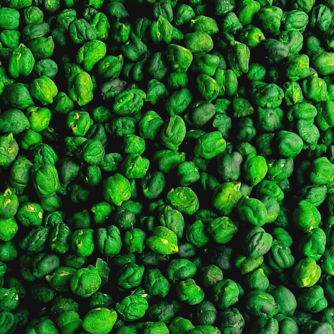 Vibrant green sensory chickpeas filler, featuring smooth, uniformly colored chickpeas in various shades of green. Ideal for sensory play, this filler offers a soothing, tactile experience and adds a refreshing, nature-inspired touch to play activities.
