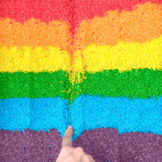 Colored rice sensory bin filler in six vibrant colors for toddlers and preschool play