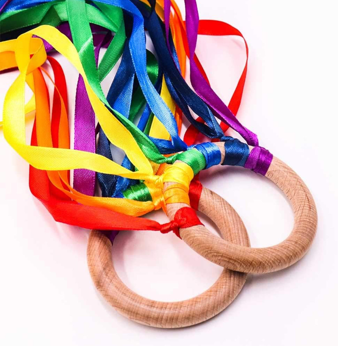 Hand kite rainbow toy with colorful ribbons and wooden rings, inspired by Waldorf education. Designed to encourage sensory exploration, motor skills, and imaginative play for young children