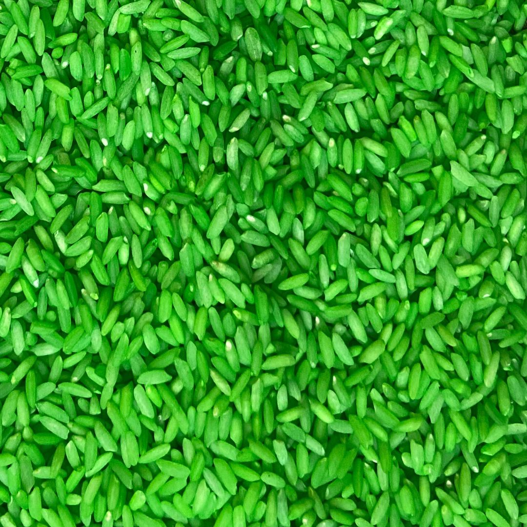 Green rainbow rice sensory bin filler for kids play