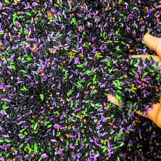 Halloween sensory bin filler mix with spooky colored rice and mix