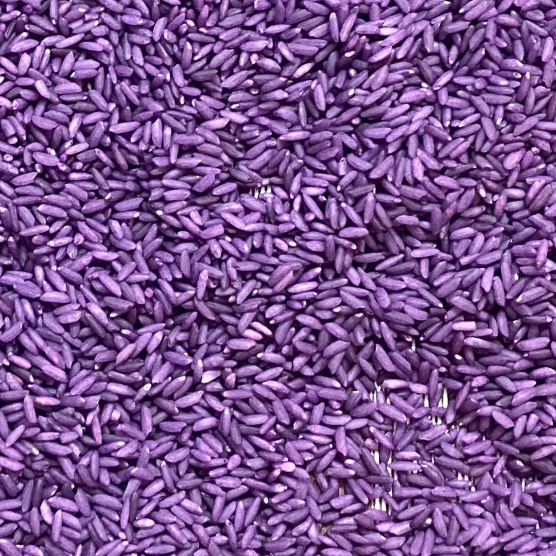 purple color rice sensory bin filler for kids play