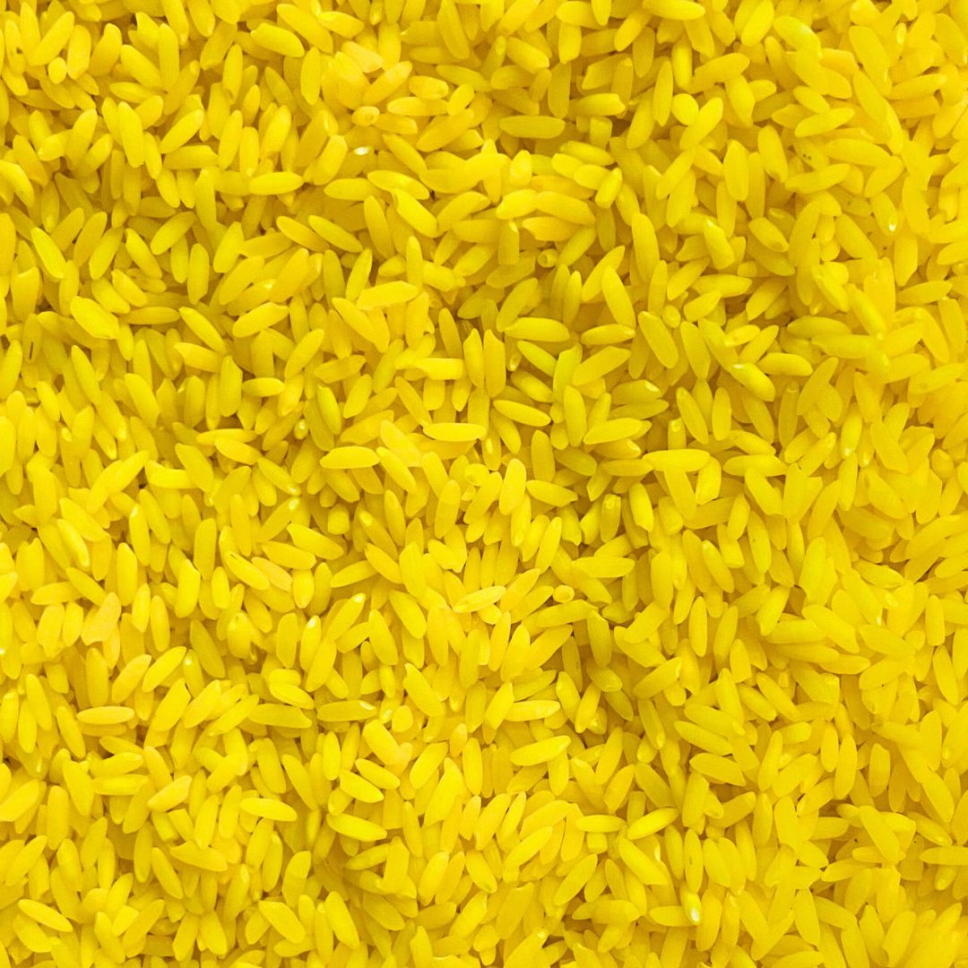 Yellow rainbow rice sensory bin filler for kids play